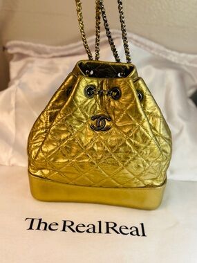 CHANEL Gabrielle Metallic Gold Quilted Drawstring Mini Bucket Backpack